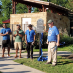 Members of Round Rock Preservation and Concord at Brushy Creek Homeowners Association cut ribbon for new historic marker for Kenney Fort June 6, 2024.