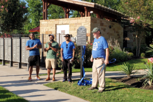 Members of Round Rock Preservation and Concord at Brushy Creek Homeowners Association cut ribbon for new historic marker for Kenney Fort June 6, 2024.