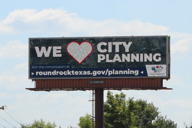 Billboard showing message We heart City Planning