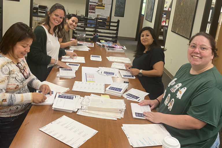 City of Round Rock Planning and Development Services staff members address invitations for the Downtown Zoning Open House on October 29, 2024.